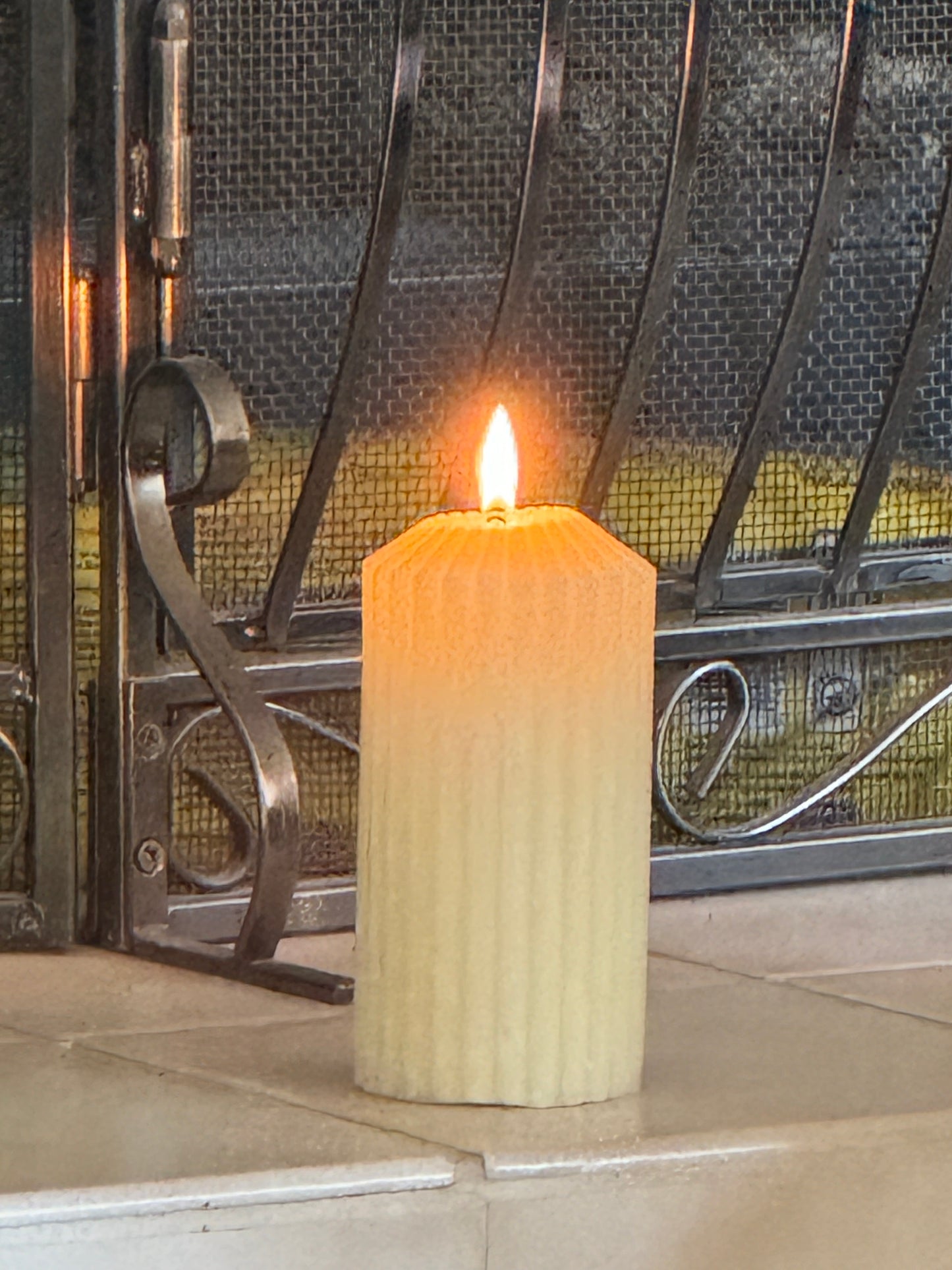 Ridged beeswax pillar candle